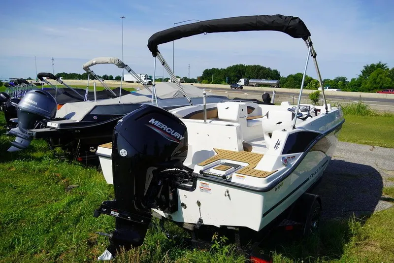 Slide: The Image of 2023 Starcraft SVX OB 171 OB boat with Mercury outboard motor on display. - 2