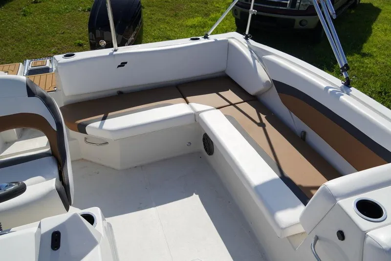 Slide: The Image of 2023 Starcraft SVX OB 171 OB boat interior with white and tan seating. - 5