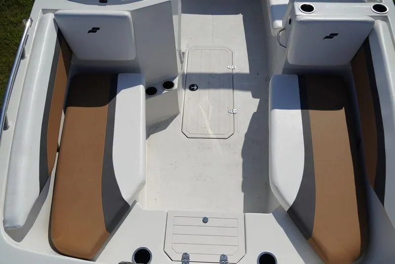 Slide: The Image of 2023 Starcraft SVX OB 171 OB boat interior with tan and white seating. - 6
