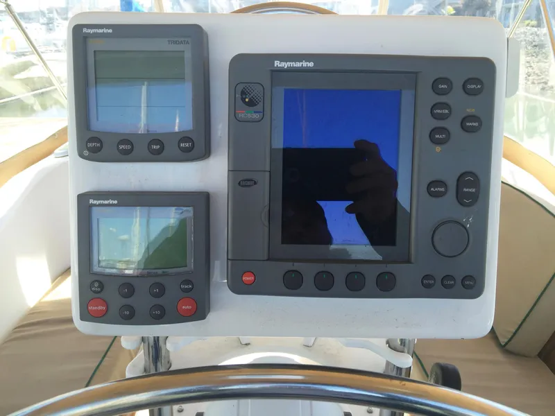 Slide: The Image of Control panel of a 2000 Beneteau Oceanis 321 sailboat with Raymarine navigation equipment. - 35