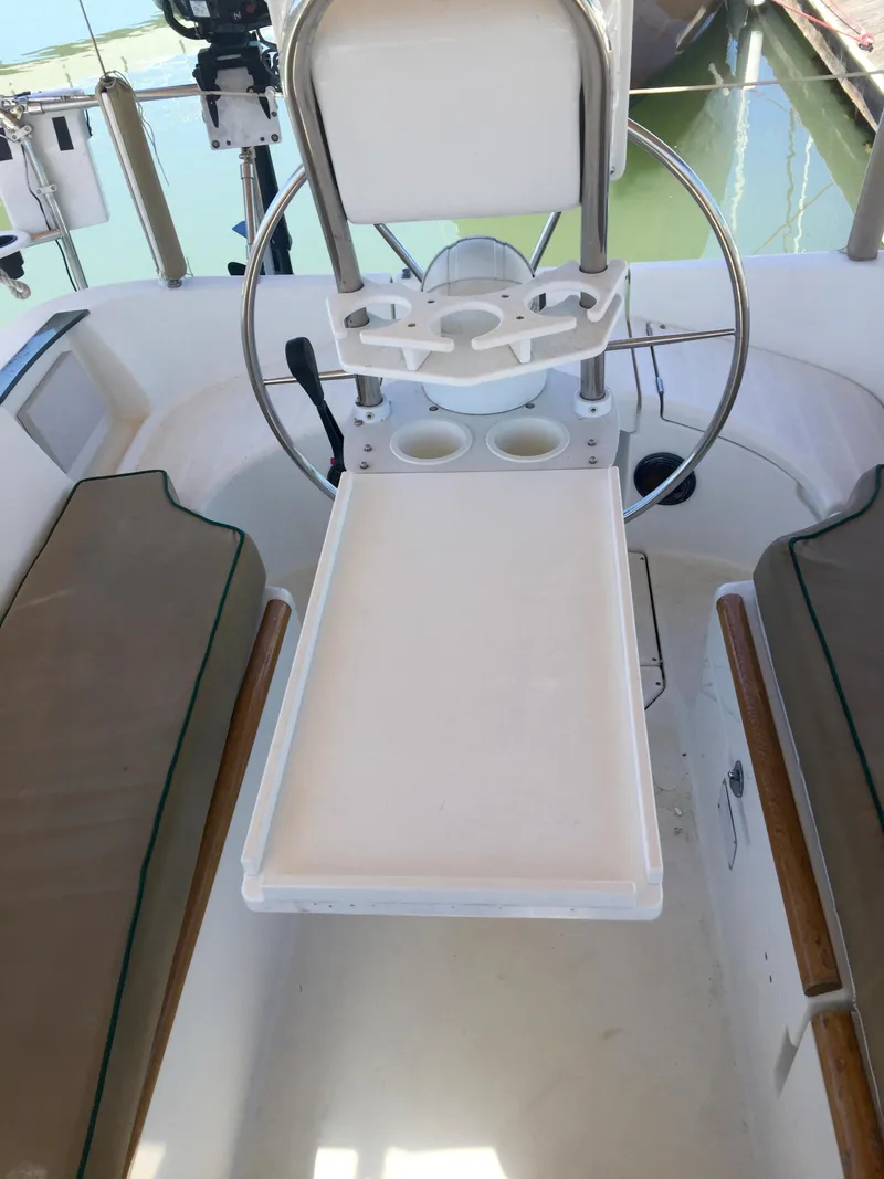 Slide: The Image of 2000 Beneteau Oceanis 321 cockpit with steering wheel and seating area. - 39