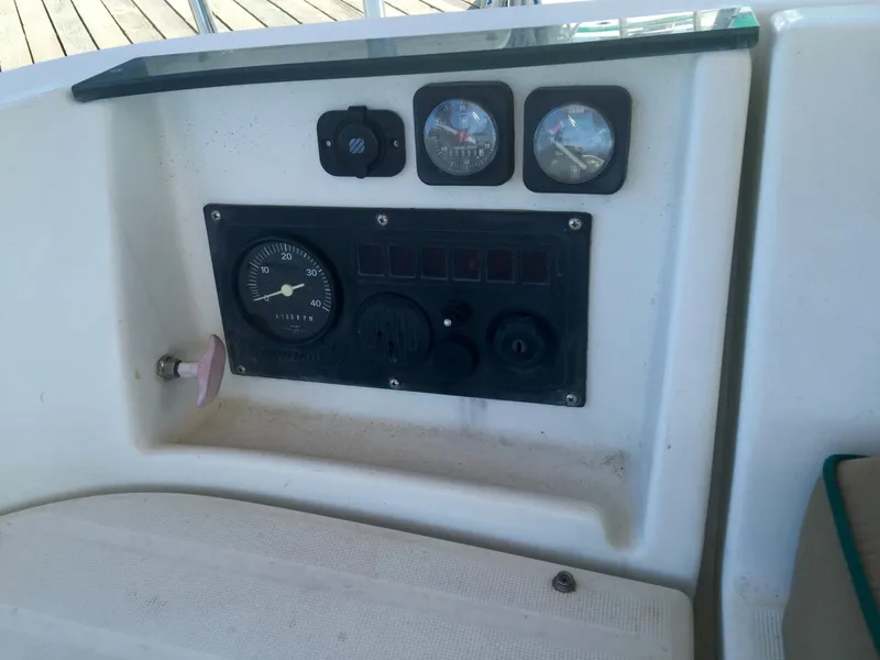 Slide: The Image of Control panel of a 2000 Beneteau Oceanis 321 sailboat, featuring gauges and switches. - 40