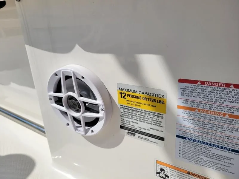 Slide: The Image of Robalo R230 boat speaker and capacity warning label, 2023 model. - 11