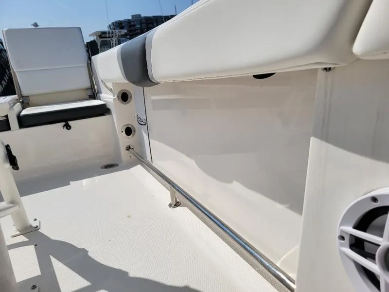 Slide: The Image of 2023 Robalo R230 boat interior with seating and speaker detail. - 16