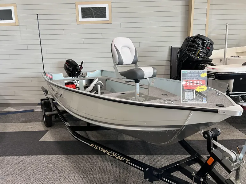 Slide: The Image of 2023 Starcraft Patriot 16 TL boat on display with sale price sign. - 1