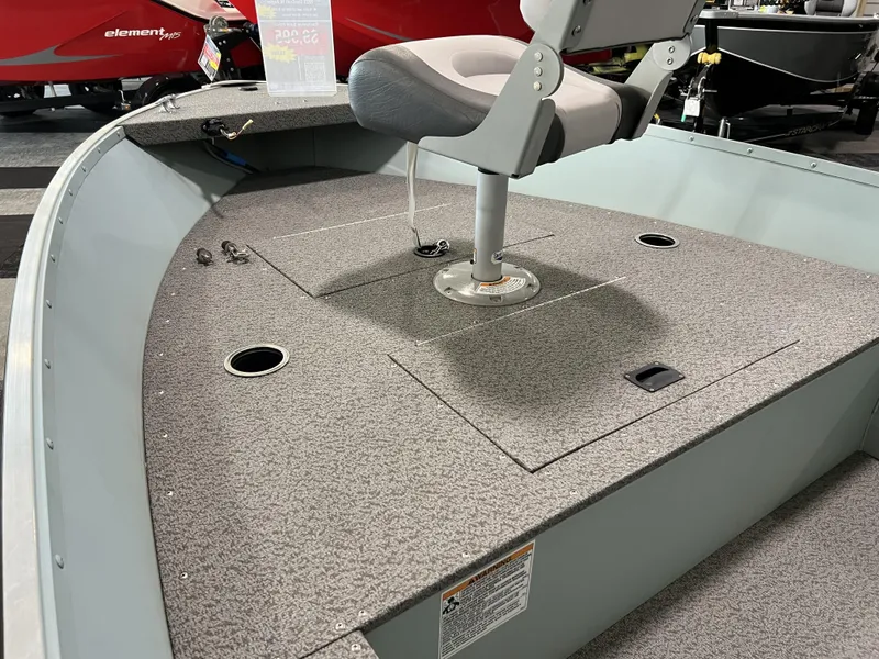 Slide: The Image of 2023 Starcraft Patriot 16 TL boat interior with swivel seat and carpeted deck. - 4