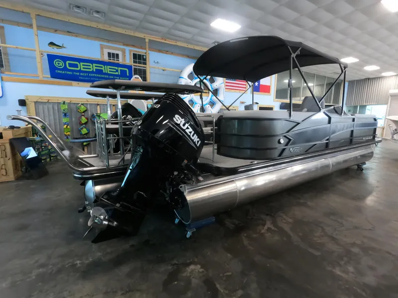 Slide: The Image of 2023 Vanderbilt 700T pontoon boat with Suzuki outboard motor in showroom. - 3