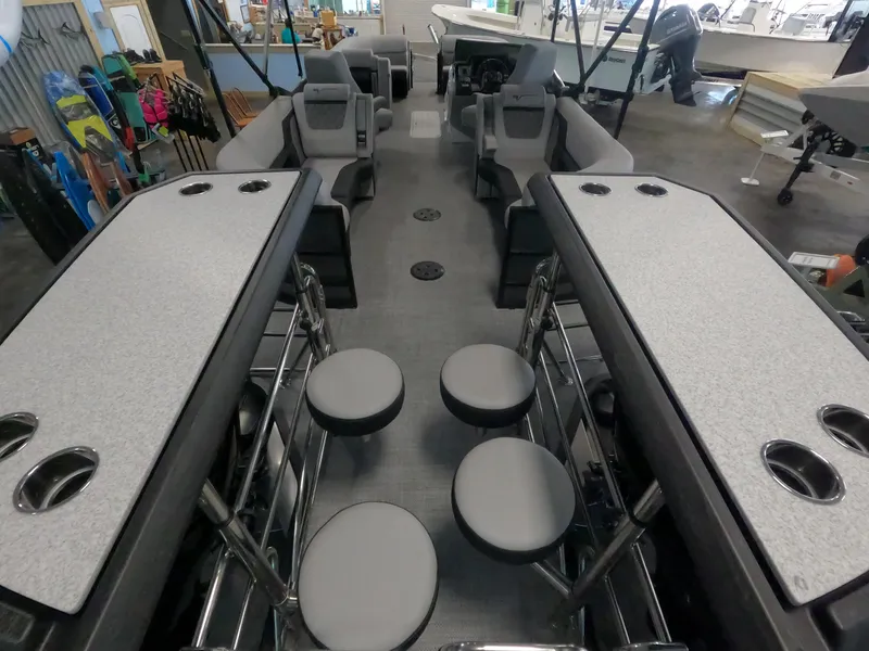 Slide: The Image of 2023 Vanderbilt 700T boat interior with seating and tables. - 4