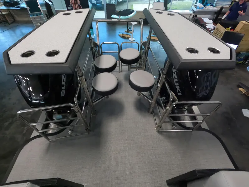 Slide: The Image of 2023 Vanderbilt 700T boat interior with seating and dual Suzuki engines. - 5
