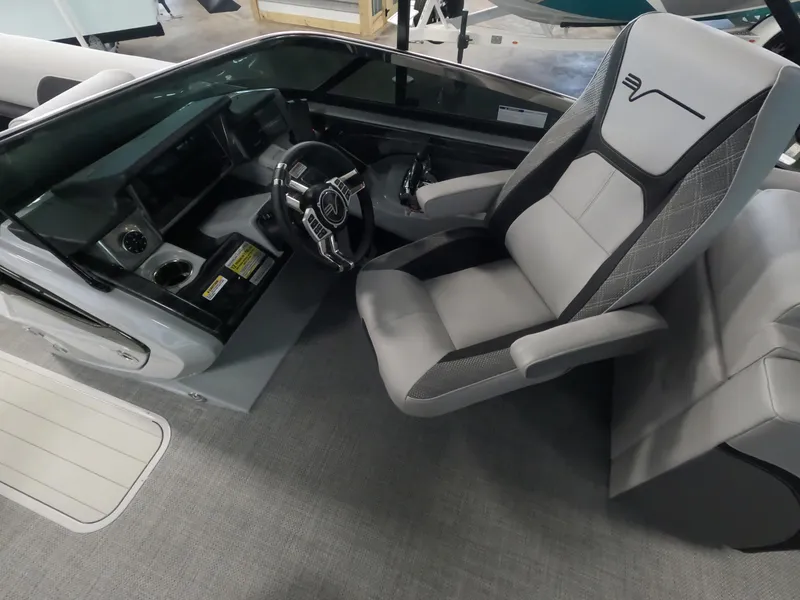 Slide: The Image of Captain's seat and dashboard of a 2023 Vanderbilt 700T boat. - 7