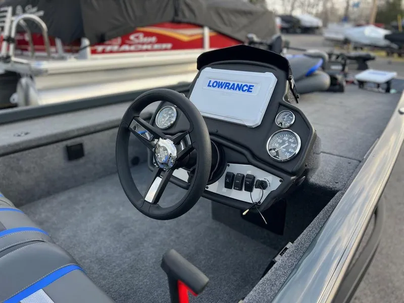 Slide: The Image of 2023 Ranger RT188C boat dashboard with Lowrance electronics and steering wheel. - 4