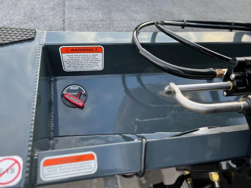 Slide: The Image of 2023 Ranger RT188C boat dashboard with warning labels and control panel. - 7