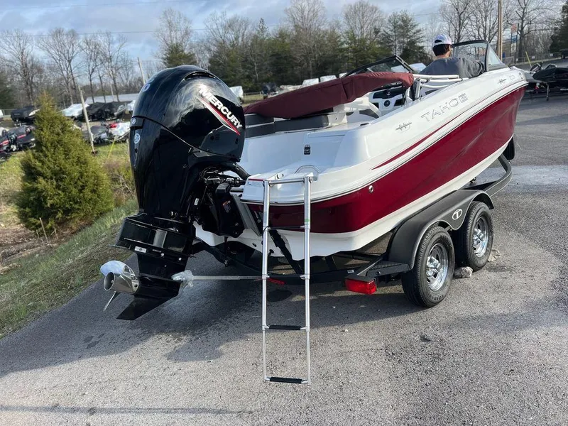 Slide: The Image of 2023 Tahoe Pontoon 200 S boat with Mercury outboard engine on trailer. - 4