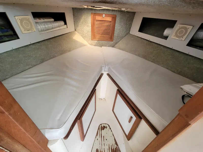 Slide: The Image of Interior cabin of 1980 Blackfin 32 Flybridge boat with V-berth and storage compartments. - 14