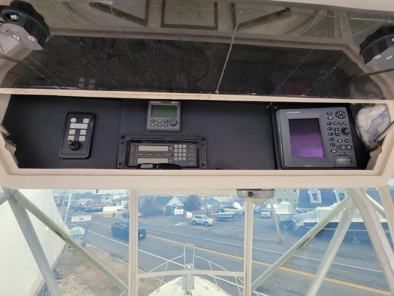 Slide: The Image of Control panel of a 1980 Blackfin 32 Flybridge boat with navigation instruments. - 21