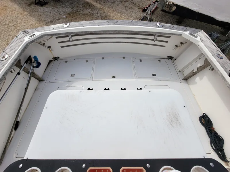 Slide: The Image of 1980 Blackfin 32 Flybridge boat deck with storage compartments. - 23