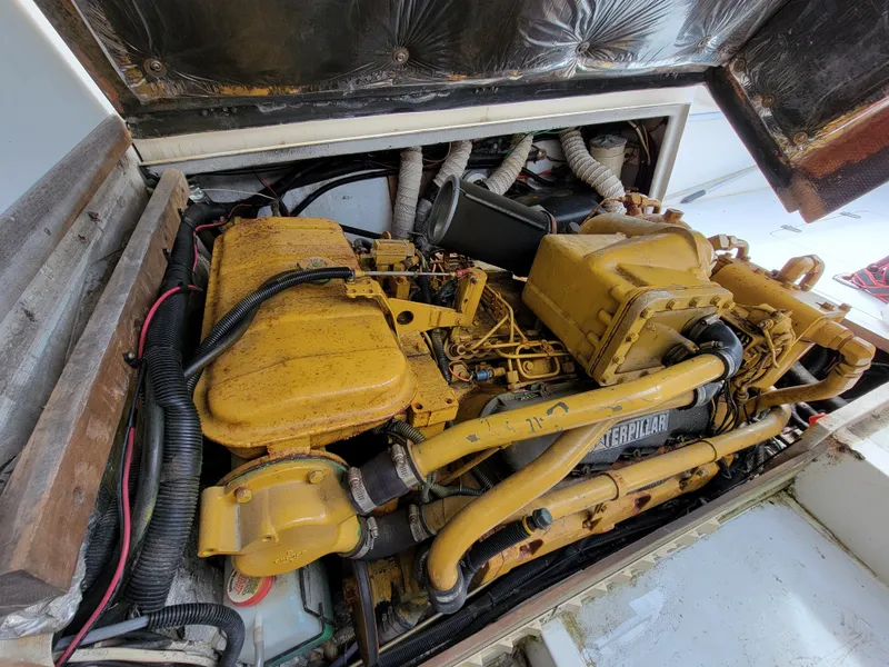 Slide: The Image of 1980 Blackfin 32 Flybridge engine compartment with Caterpillar diesel engine. - 24
