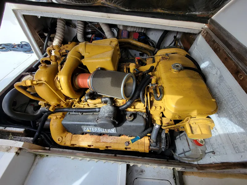 Slide: The Image of 1980 Blackfin 32 Flybridge engine compartment with Caterpillar diesel engine. - 25