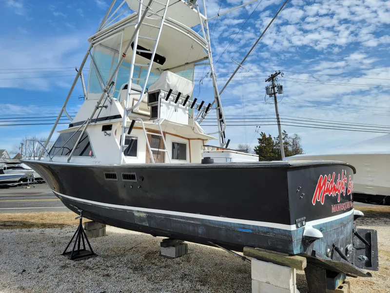 Slide: The Image of 1980 Blackfin 32 Flybridge boat on stands, ready for maintenance. - 4