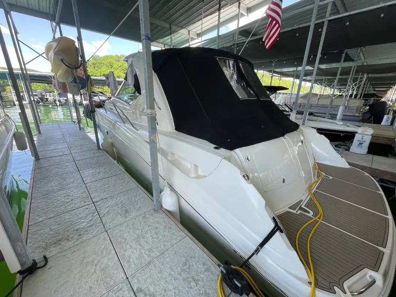 Slide: The Image of 2007 Sea Ray 38 Sundancer docked under a covered marina. - 12