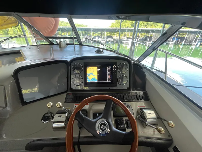 Slide: The Image of Helm of 2007 Sea Ray 38 Sundancer with navigation display and controls. - 2