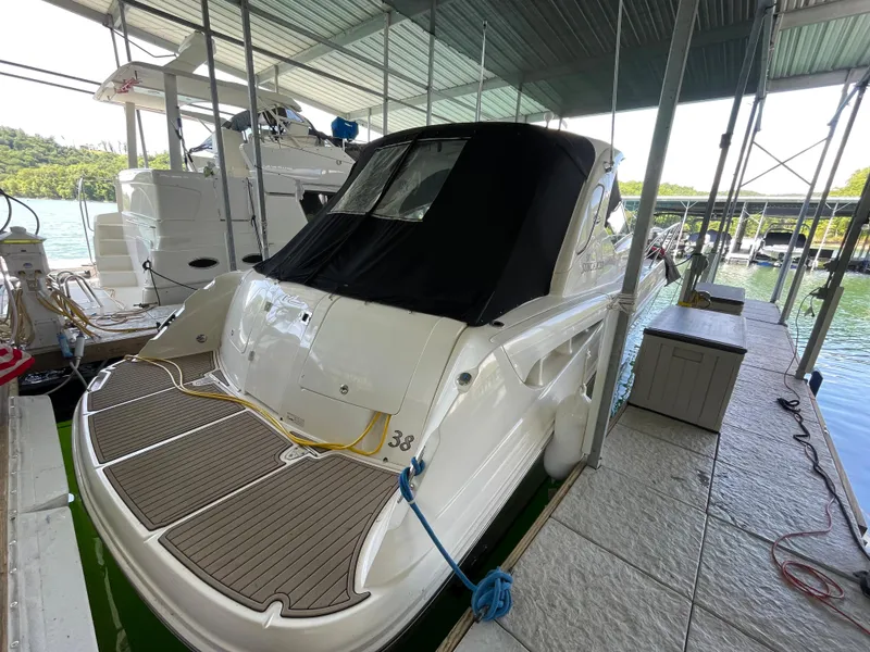 Slide: The Image of 2007 Sea Ray 38 Sundancer docked in a covered marina. - 21