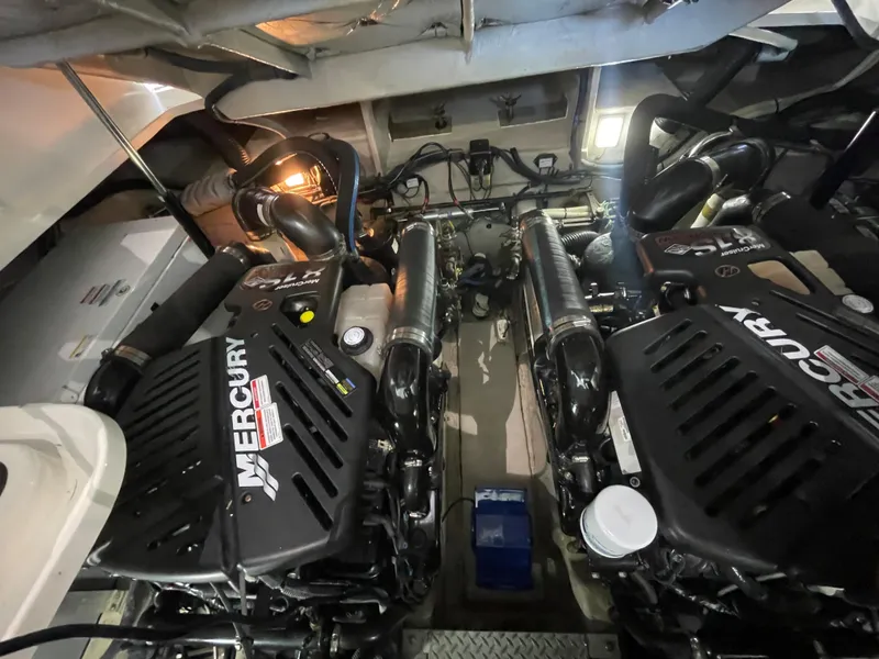 Slide: The Image of Engine room of a 2007 Sea Ray 38 Sundancer with twin Mercury engines. - 26