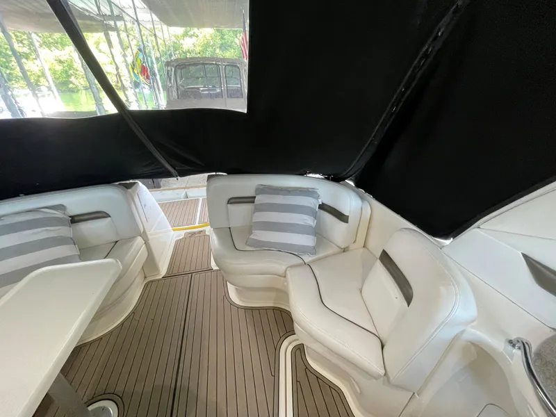 Slide: The Image of Interior seating area of a 2007 Sea Ray 38 Sundancer yacht with striped cushions. - 7
