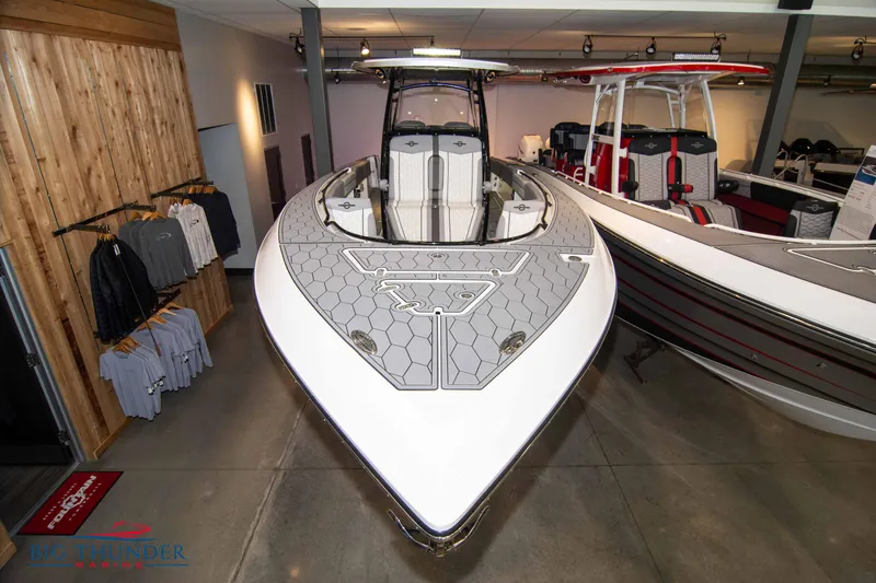 Slide: The Image of 2023 Fountain 34 SC boat on display in showroom. - 11
