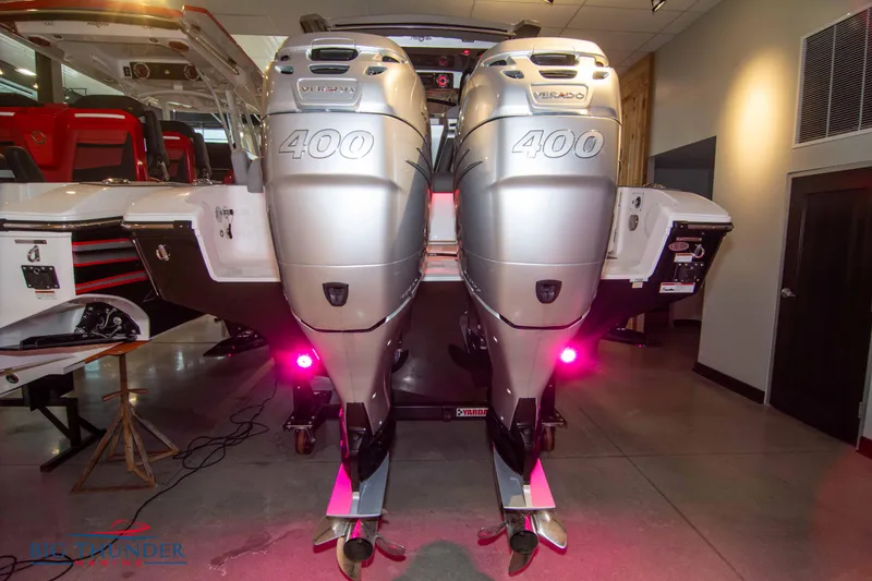 Slide: The Image of 2023 Fountain 34 SC boat with twin Mercury 400 outboard engines in showroom. - 14