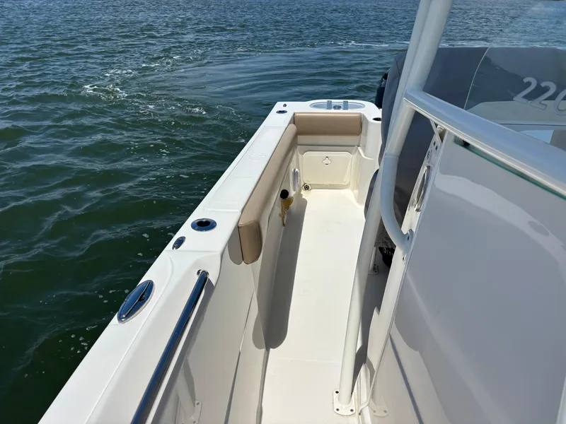 Slide: The Image of 2020 Sailfish 220 CC boat deck with ocean view, featuring sleek design and spacious layout. - 10