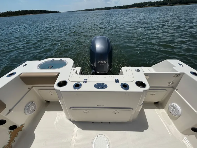 Slide: The Image of 2020 Sailfish 220 CC boat with Yamaha 200 engine on a calm water body. - 17