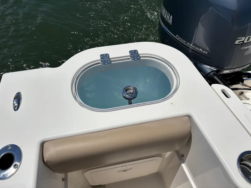 Slide: The Image of 2020 Sailfish 220 CC boat with Yamaha engine and livewell on deck. - 24