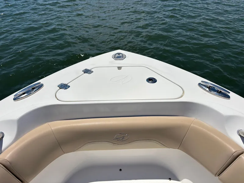 Slide: The Image of 2020 Sailfish 220 CC boat bow with tan seating and ocean view. - 7