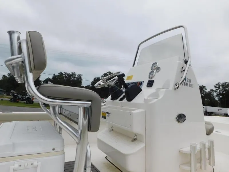 Slide: The Image of 2023 Key West 210BR boat console and seating area. - 11