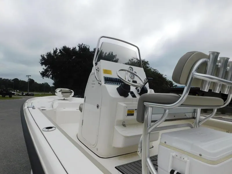 Slide: The Image of 2023 Key West 210BR boat console and seating area. - 12