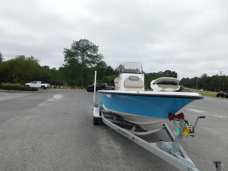 Slide: The Image of 2023 Key West 210BR boat on a trailer in a parking lot. - 3