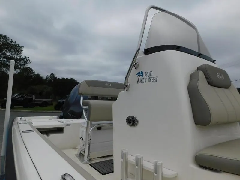 Slide: The Image of 2023 Key West 210BR boat with seating and console, side view. - 6