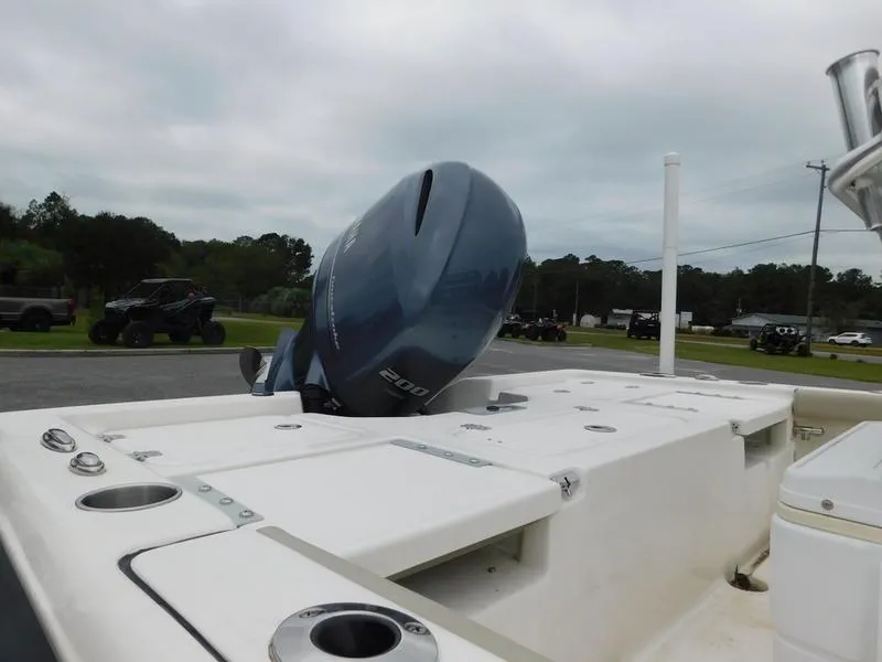 Slide: The Image of 2023 Key West 210BR boat with 200HP outboard motor, rear deck view. - 7