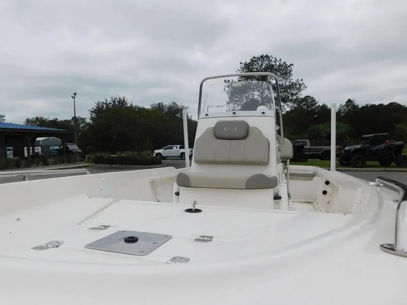 Slide: The Image of 2023 Key West 1720CC center console boat, white interior, outdoor setting. - 10