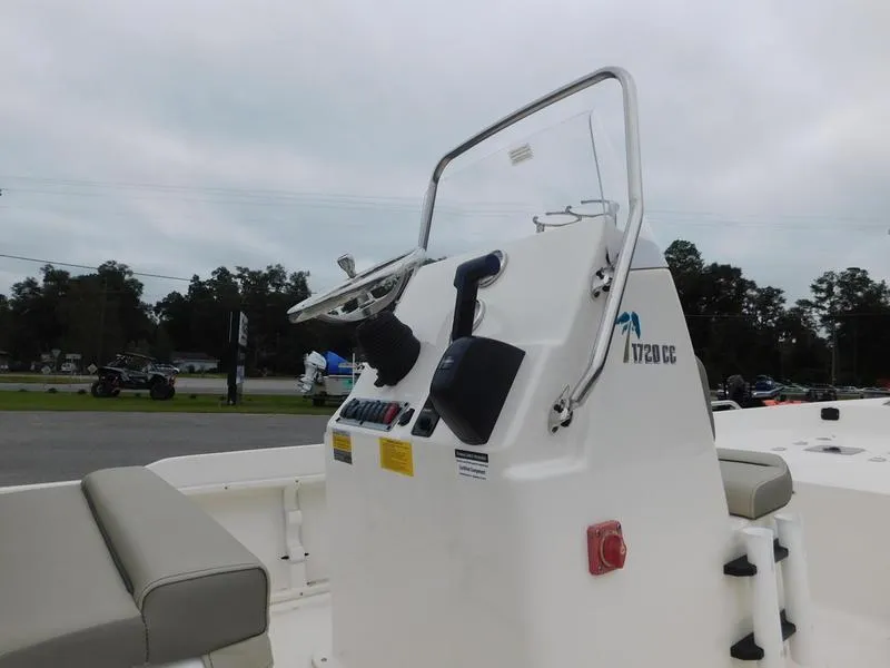 Slide: The Image of 2023 Key West 1720CC center console boat with steering wheel and controls. - 7
