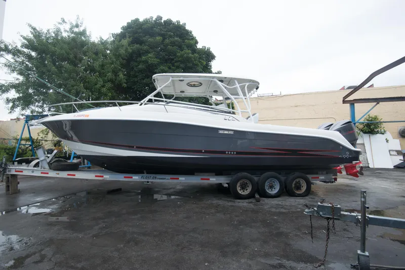 Slide: The Image of 2006 Hydra-Sports Vector 3300 VX boat on a trailer, parked outdoors. - 10