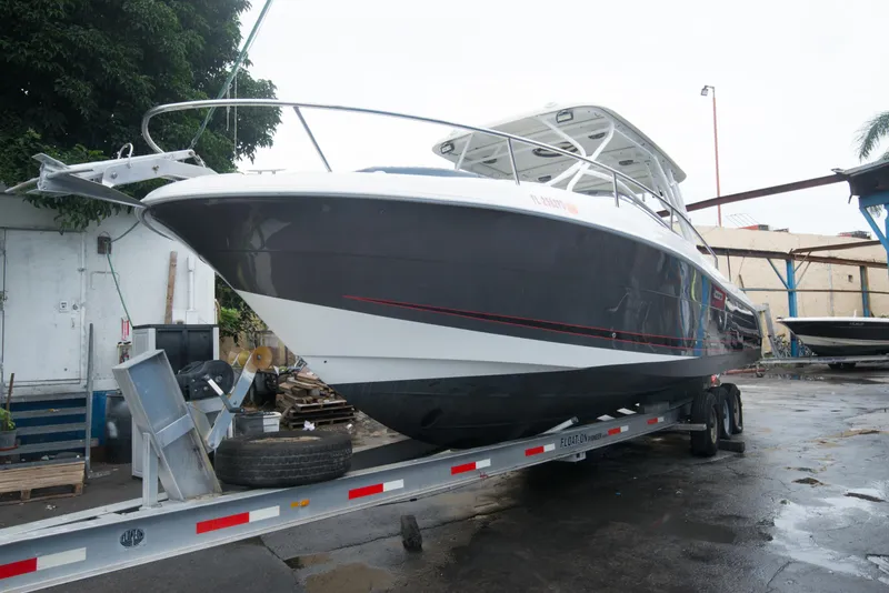 Slide: The Image of 2006 Hydra-Sports Vector 3300 VX boat on a trailer in a marina. - 11
