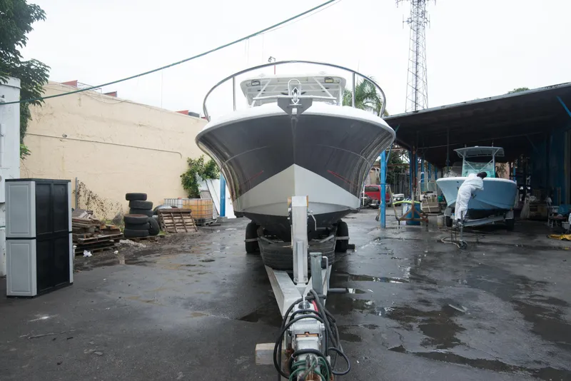 Slide: The Image of 2006 Hydra-Sports Vector 3300 VX boat on trailer in a maintenance yard. - 12