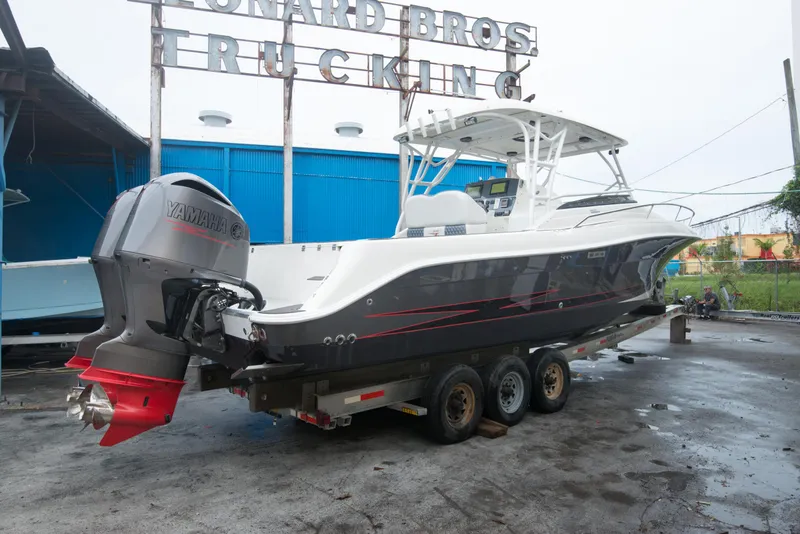Slide: The Image of 2006 Hydra-Sports Vector 3300 VX boat on a trailer with Yamaha outboard engines. - 15