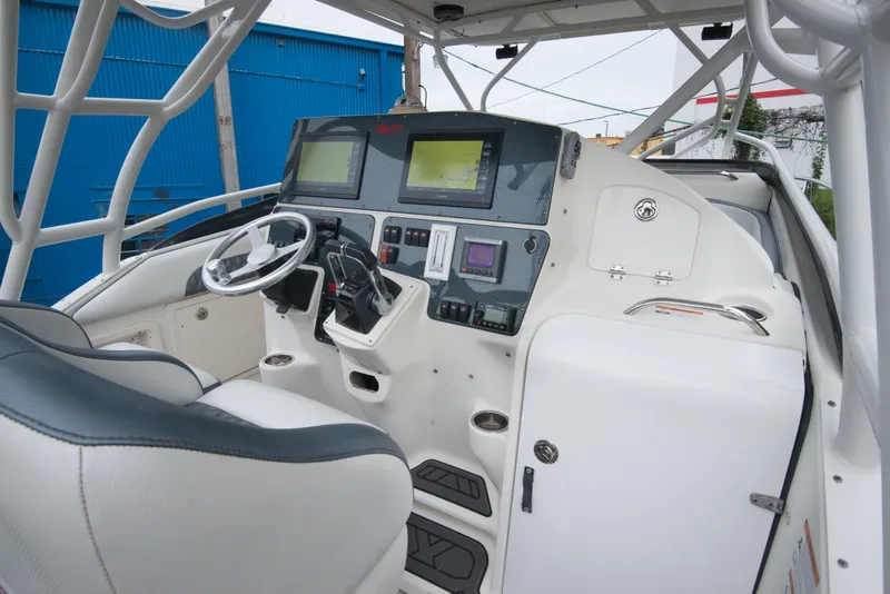 Slide: The Image of 2006 Hydra-Sports Vector 3300 VX boat cockpit with advanced navigation systems. - 18