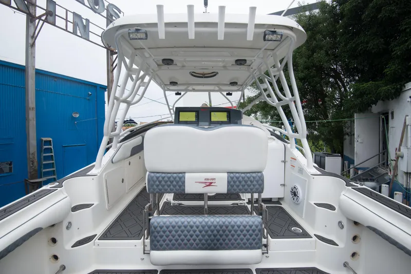 Slide: The Image of 2006 Hydra-Sports Vector 3300 VX boat interior with seating and helm station. - 22