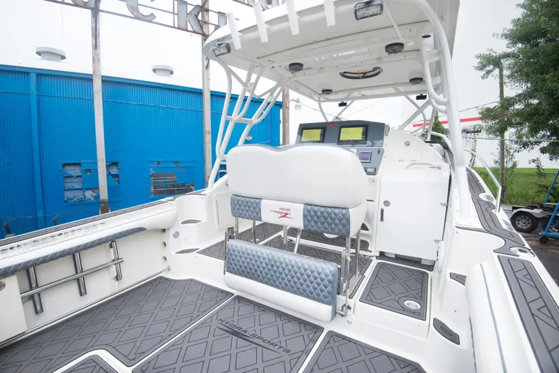 Slide: The Image of 2006 Hydra-Sports Vector 3300 VX boat interior with dual helm seats and navigation equipment. - 23