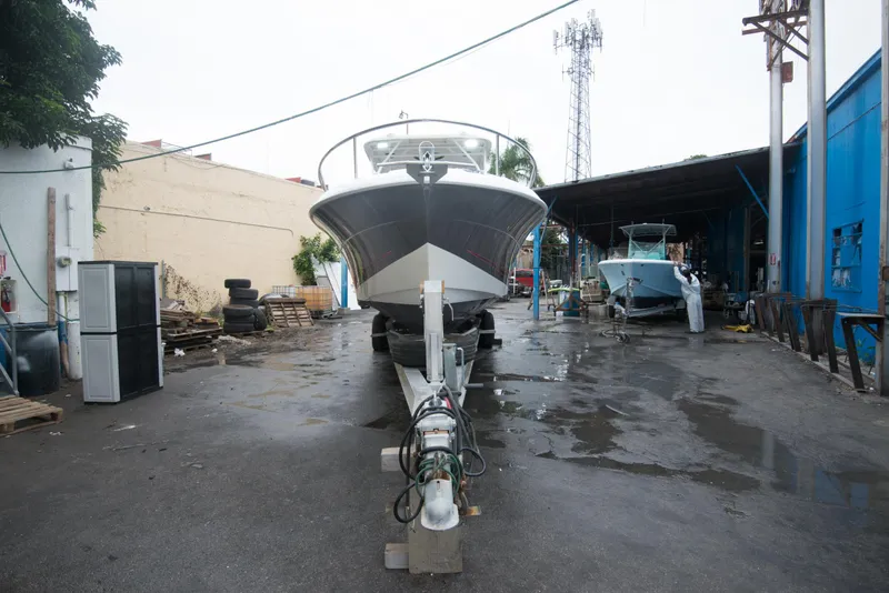 Slide: The Image of 2006 Hydra-Sports Vector 3300 VX boat on a trailer in a boatyard. - 3