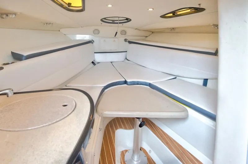 Slide: The Image of 2006 Hydra-Sports Vector 3300 VX cabin interior with seating and table. - 31